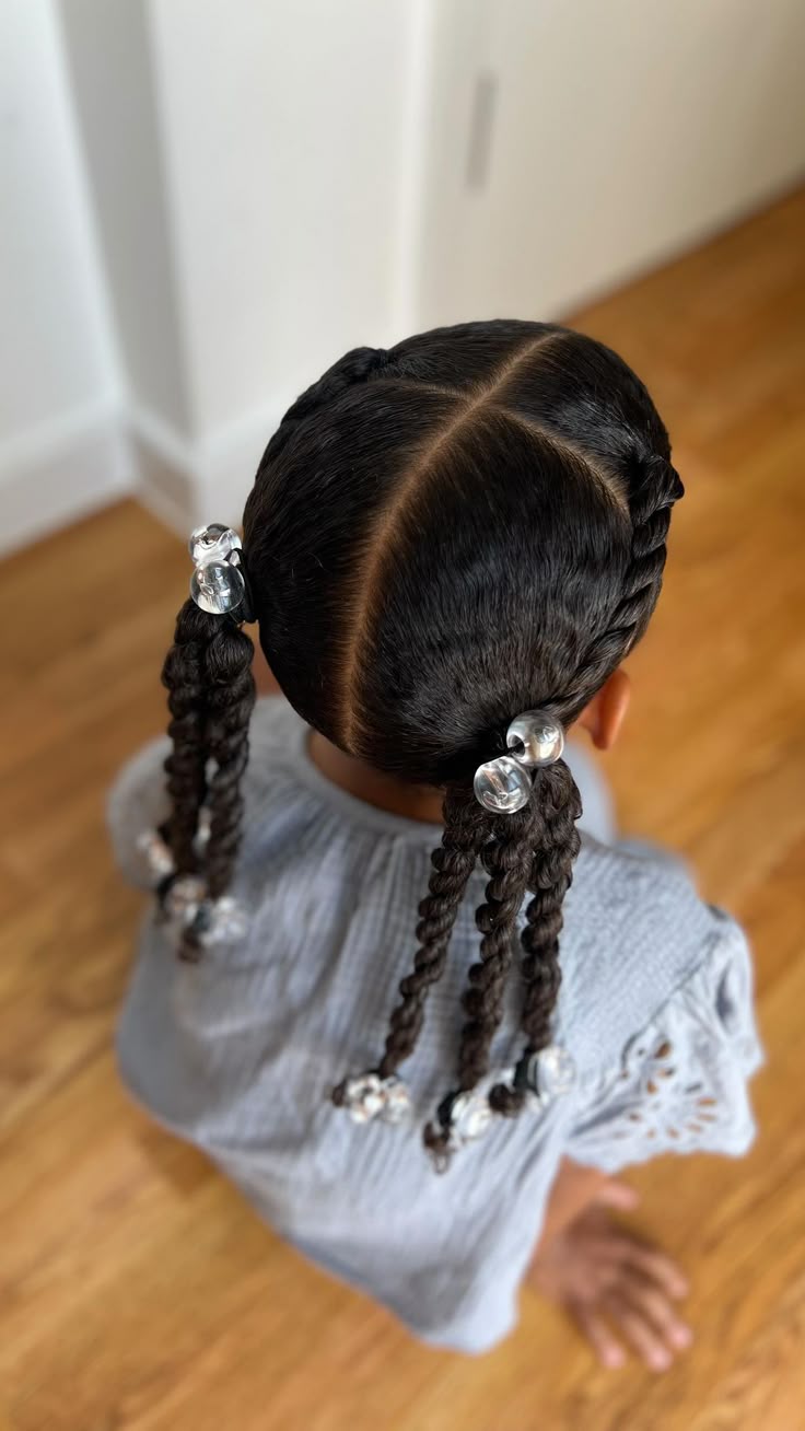 cute girl with a cute twisted front section hair. and a twisted  ponytail