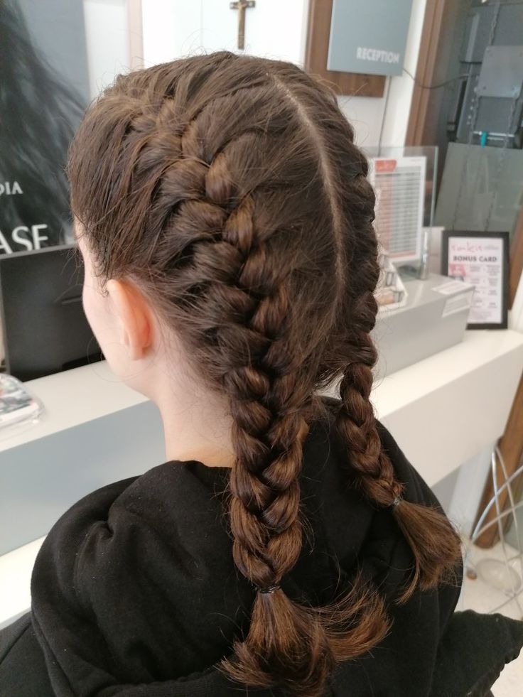 Twin French braids split down the middle and braided close to the scalp