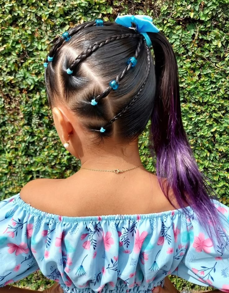 Child with a side twist styled toward one side of the head, finished with a small clip