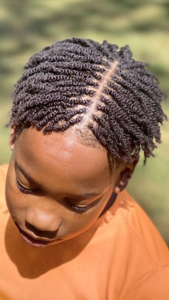 Young boy with full textured mini twist hairstyle