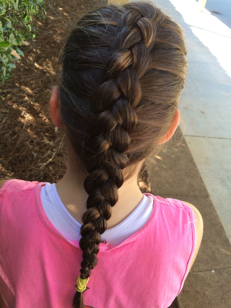 Single Dutch braid with a raised, three-dimensional look on curly hair
