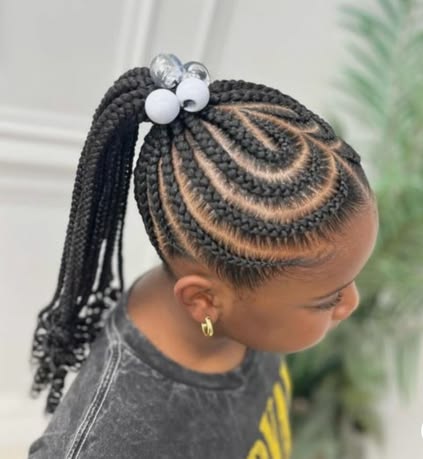 Girl with a beautifully styled braided updo hairstlye with curled ends