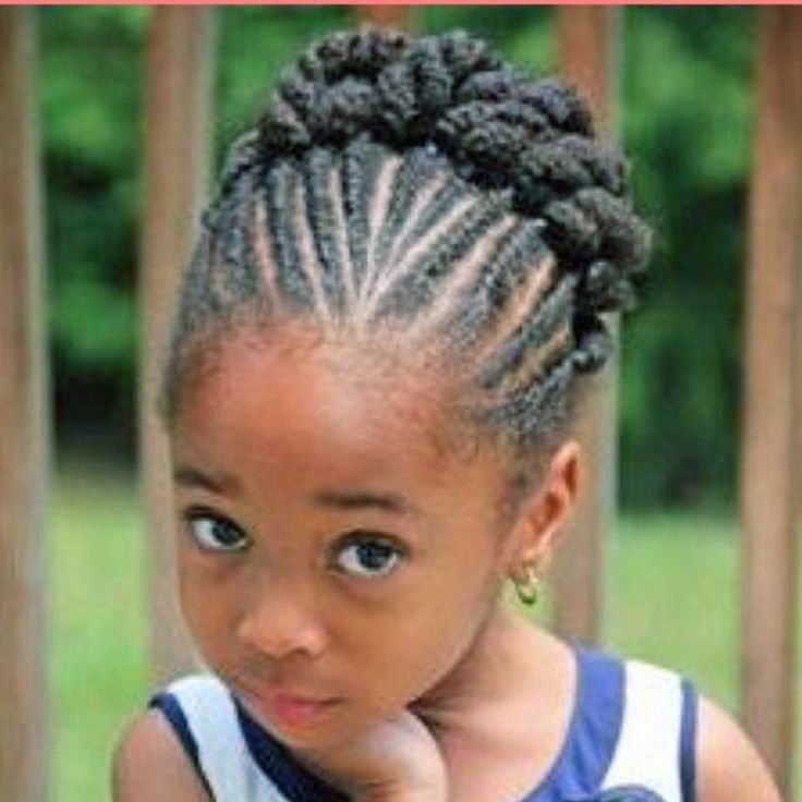 Toddler with cornrow twists styled into a crown updo