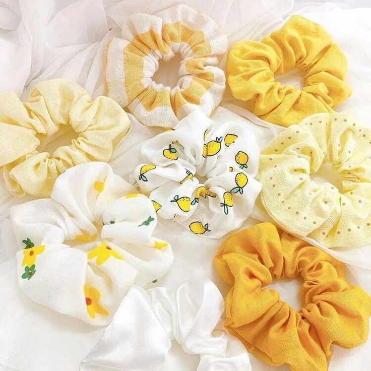Fabric scrunchies in yellow and white patterns