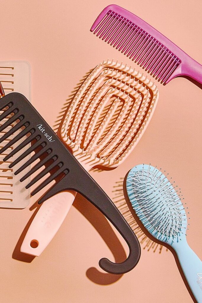 A flat lay of wide combs  and detangling brushes