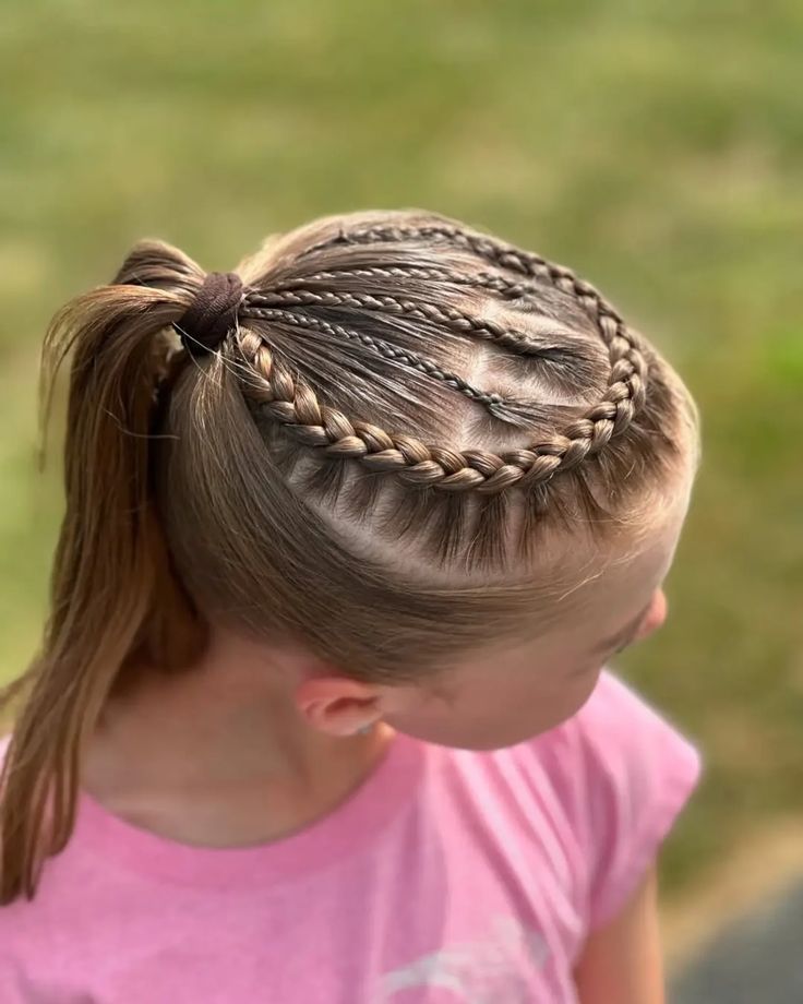Yong girl with a low ponytail with braided front