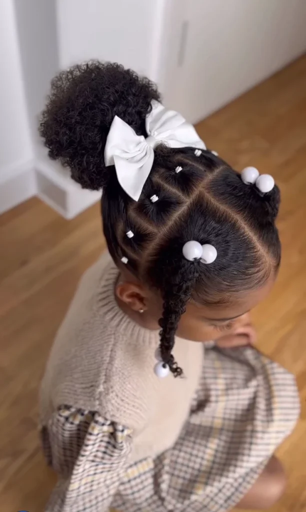 Cute low puffs with designs in the front of the hair