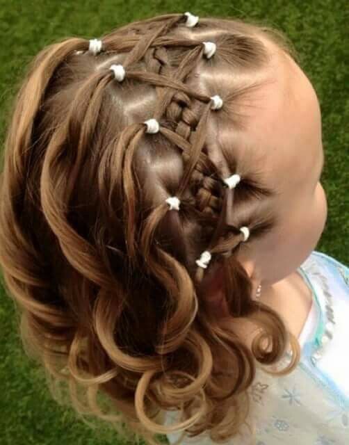 Cute little girl with a criss crossed braided headband