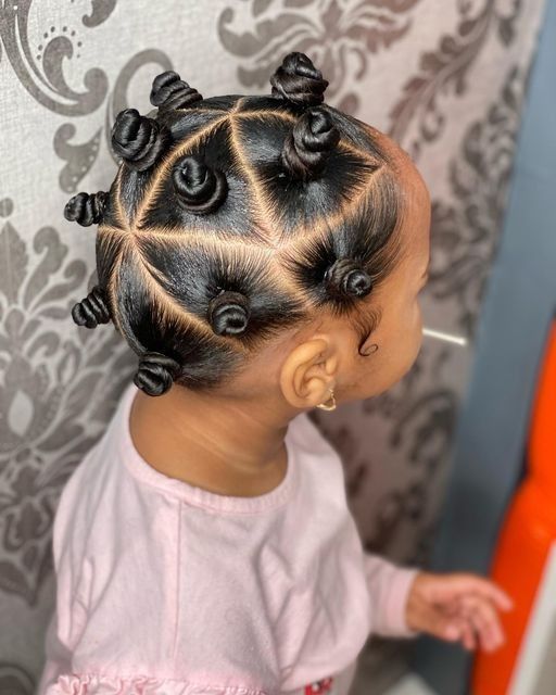 Young girl with hair styled in a braided bun