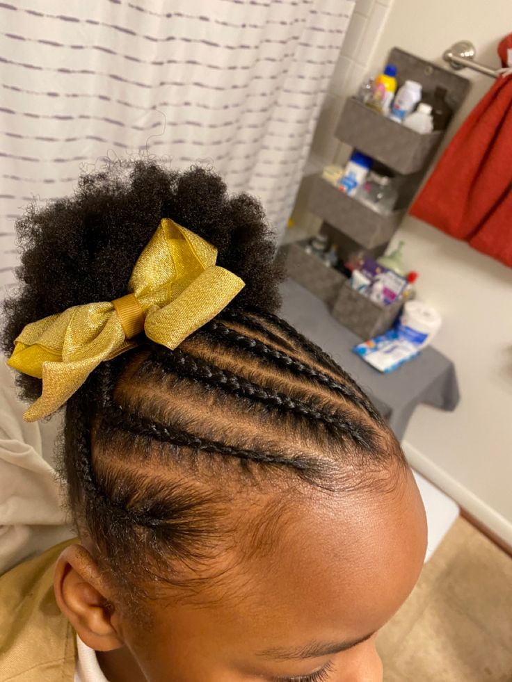 Adorable toddler with braid in the front puffs 