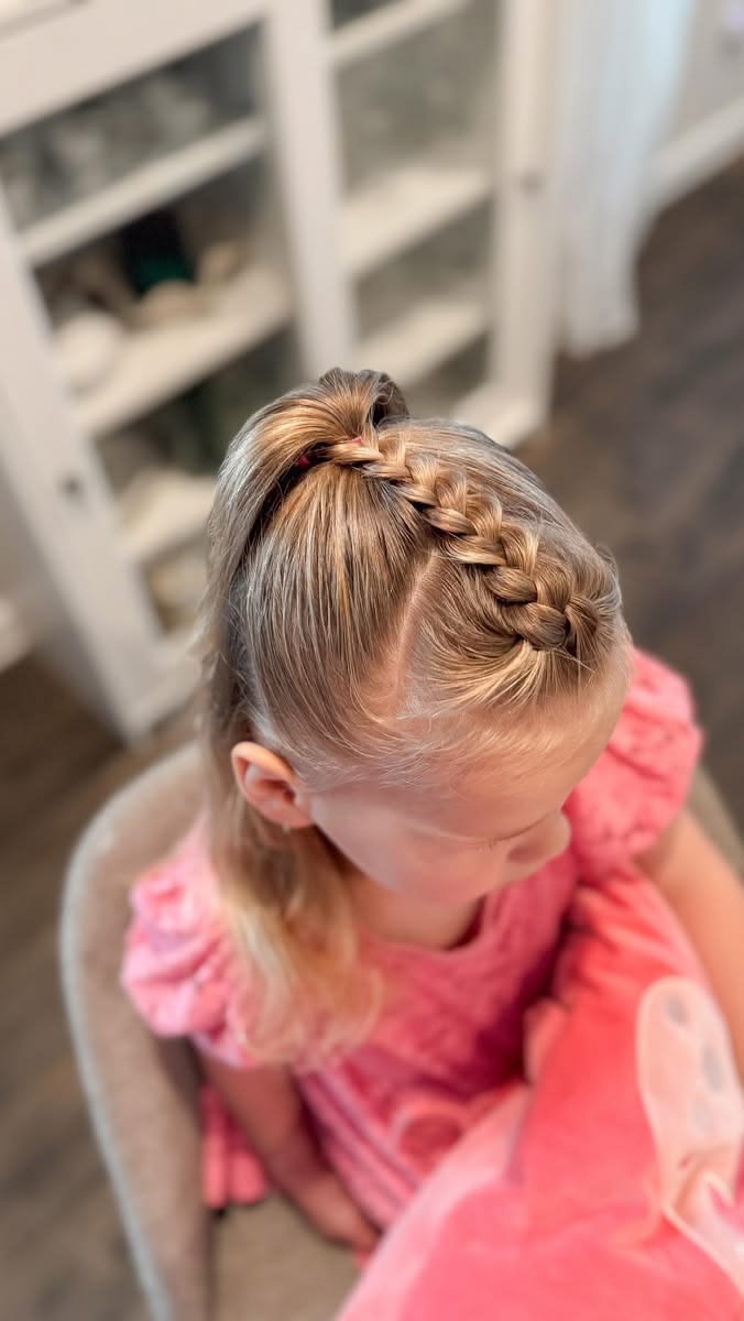 young white girl with French braids inserted into her ponytail 