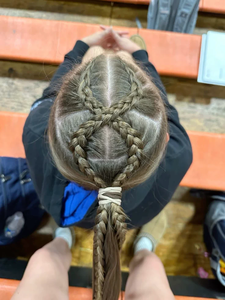young girl with a cross wrap ponytail for sports