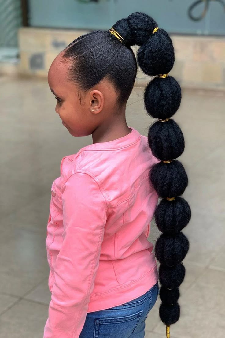 adorable girl with sleek bubble ponytail with extention. 