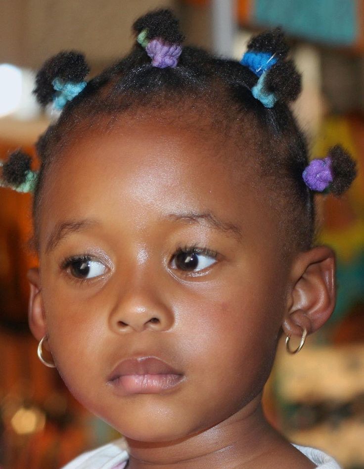 Young cute black girl with a mini puff rows hairstyle  