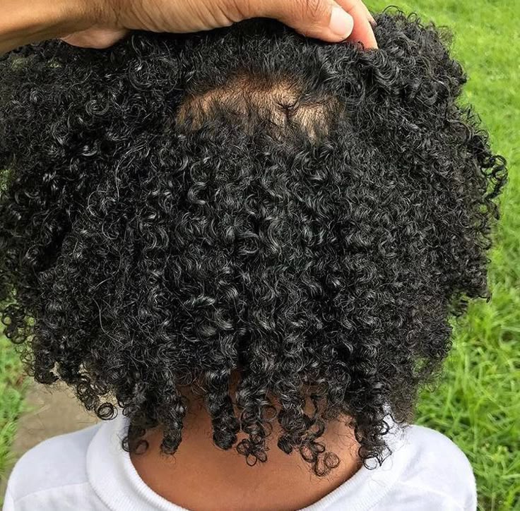 Young girl with a coily hair
