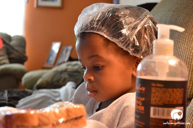 Child in shower cap during conditioning
