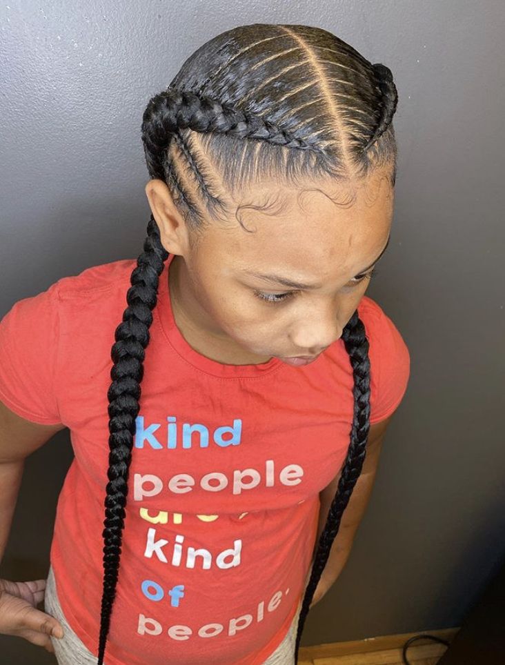 Young girl with cornrow with center part