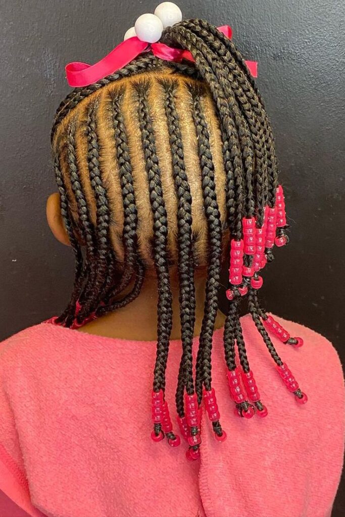 Young girl with a cute Beaded Cornrows