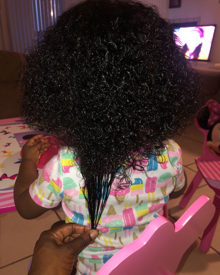 Close-up of shiny, healthy curls showing signs of a working hair routine