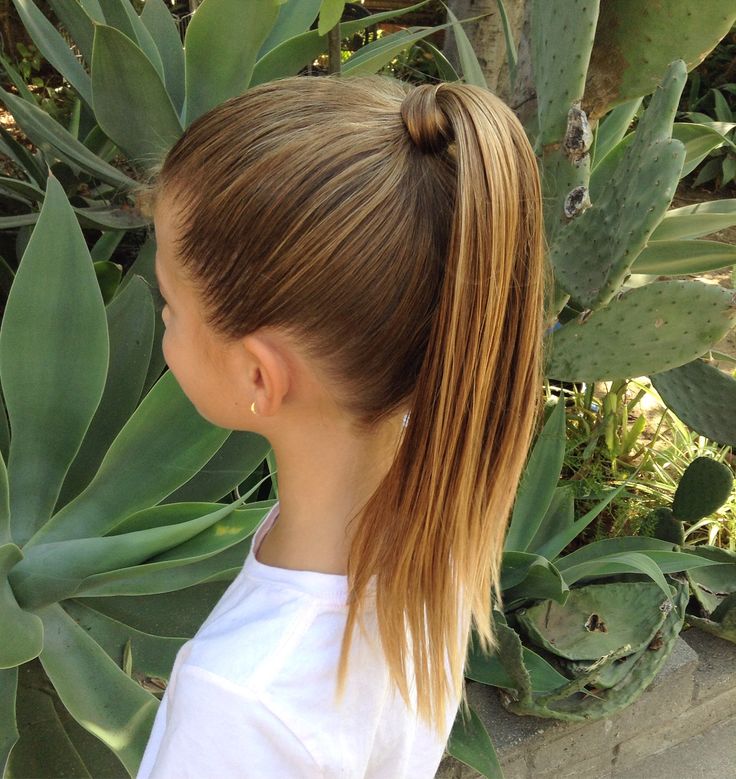 young girl with a high ponytailed hair with a hair wrap .