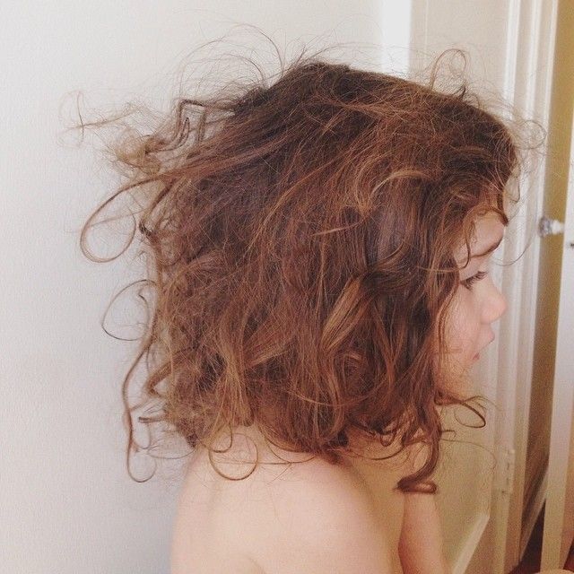A little girl with a tangled hair