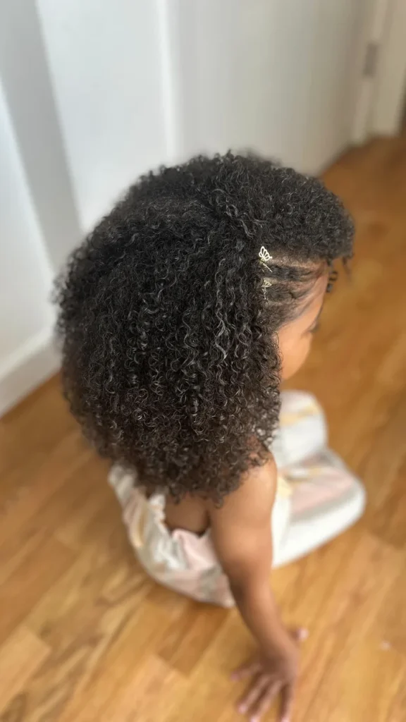 Young girl with a styled curly hair