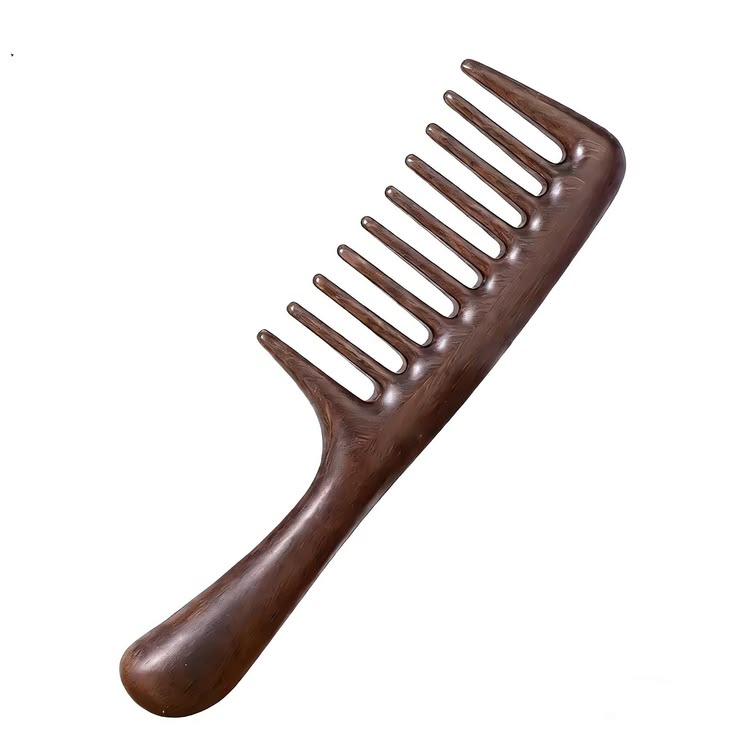 A brown wooden wide tooth comb