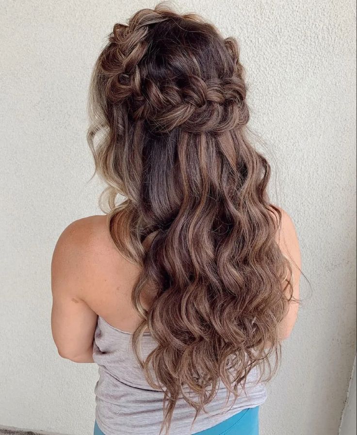 Young girl with hair styled in a half-up braided crown
