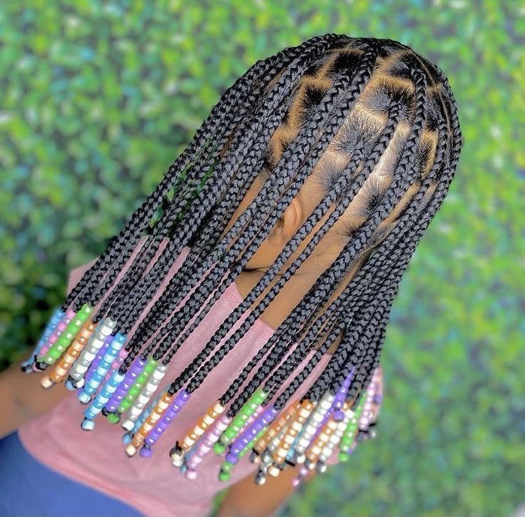 young girl with boxbraids and colorful beads