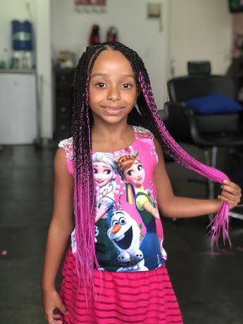 Ombre knotless braids for kids blending dark roots into lighter braid colors.