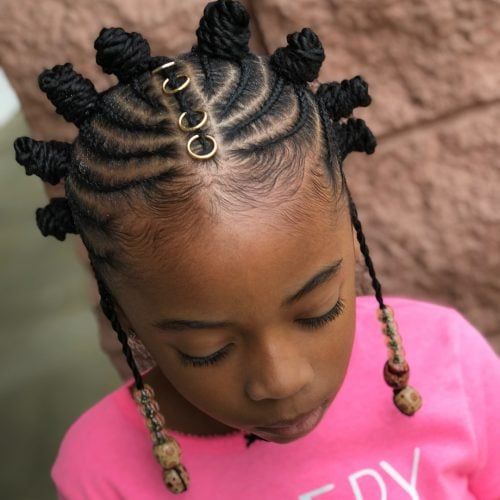 Young girl with a cornrow and bantu combo 