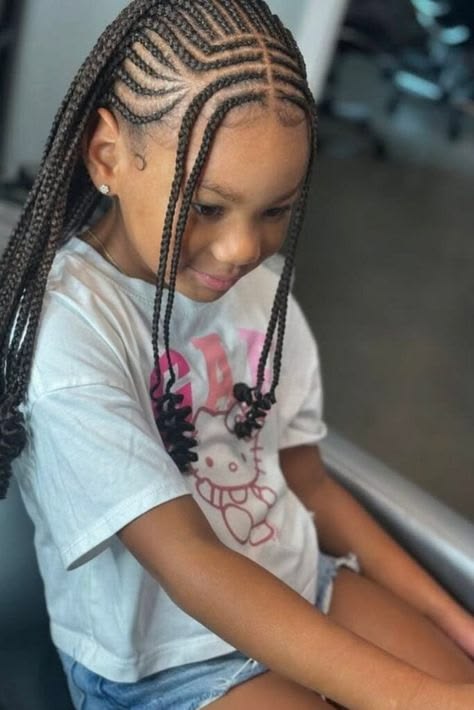 Little girl wearing Fulani inspired feed in braids with front braids framing the face.