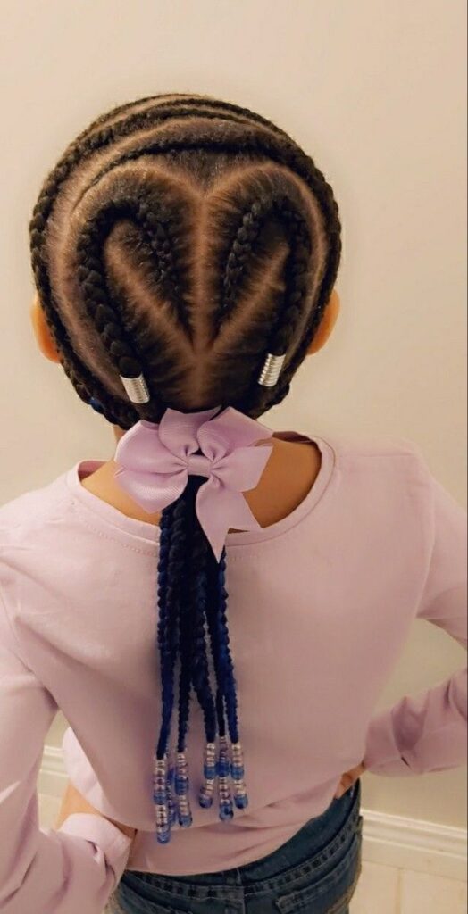 Feed in braids with a heart shaped parting on a little girl.