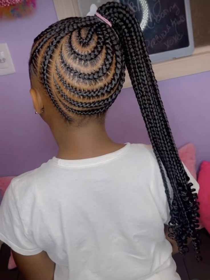 Little girl wearing side ponytail feed in braids with neat braided sections