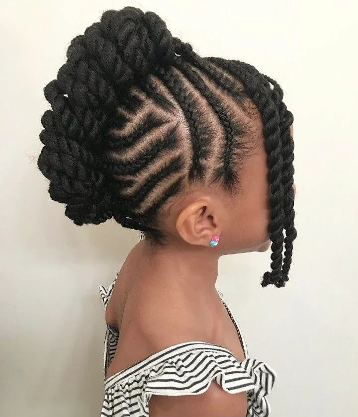 A young girl with a beautiful cornrow mohawk