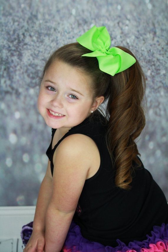 Cute white girl with a lemon bow attached to her ponytail