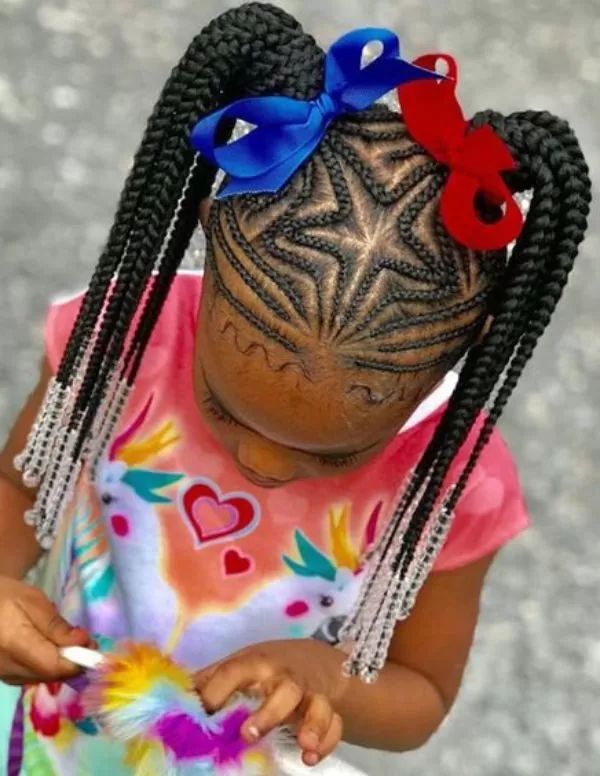 Young girl with a start part beaded braid