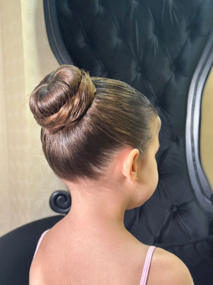 Young girl with a classic ballet bun
