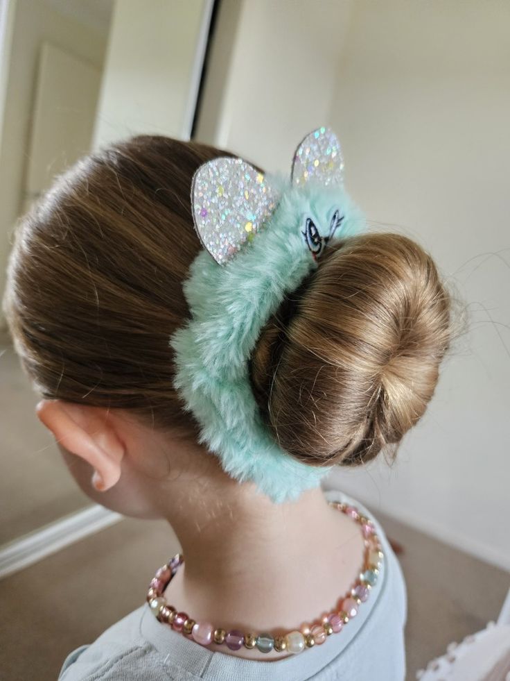 Young girl with a sock bun