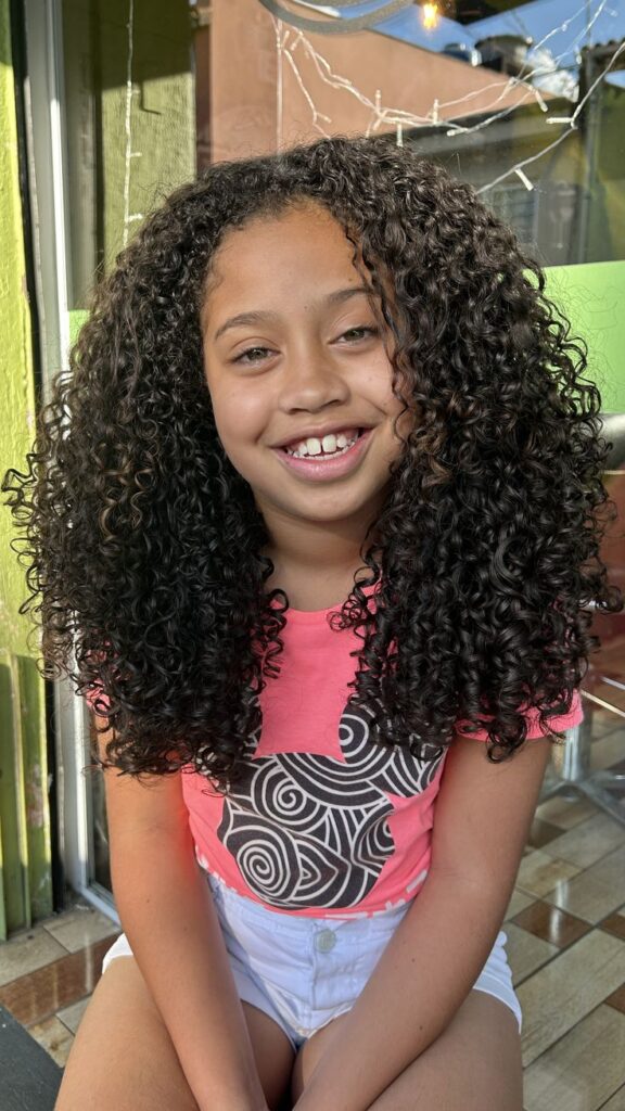 Young girl with a nice wash and go curls.  
