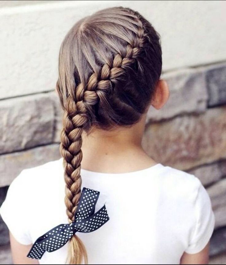 Young girl with straight hair styled in a single side braid