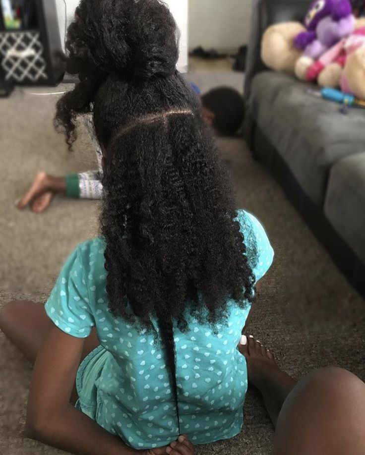 Type 4 natural hair puff and twists showing curl shrinkage