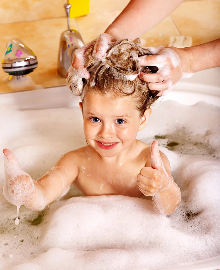 toddler getting her hair washed