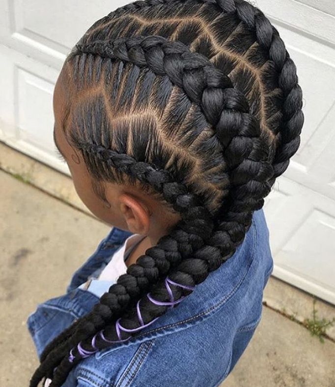 Little girl wearing chunky jumbo feed in braids with clean sections.