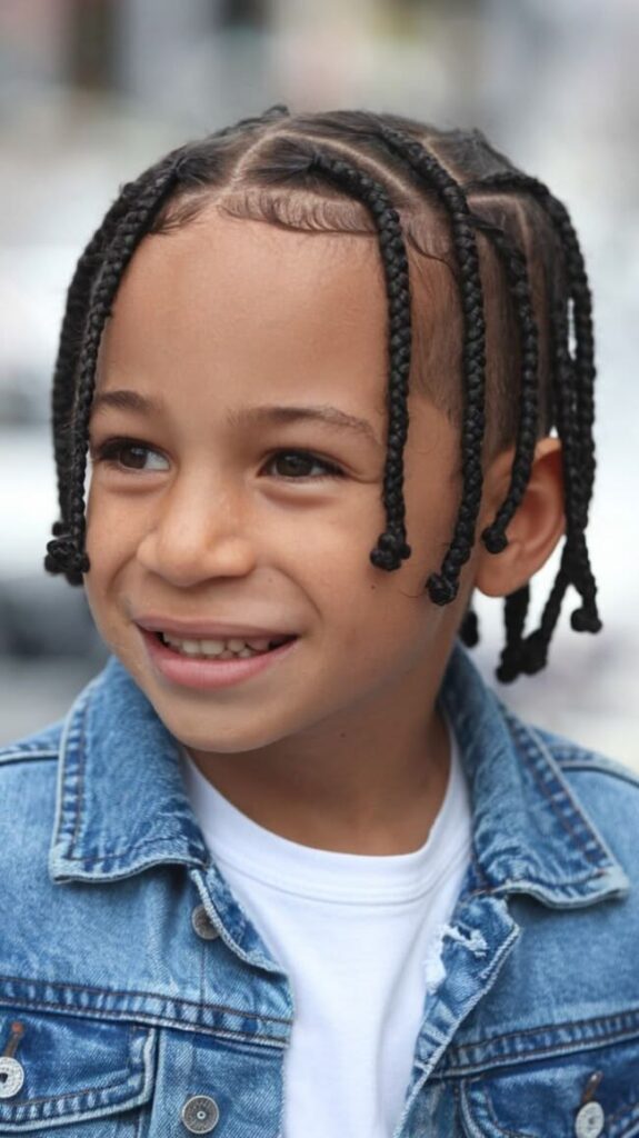 Boy with  box Braids with Fade hairstyle 