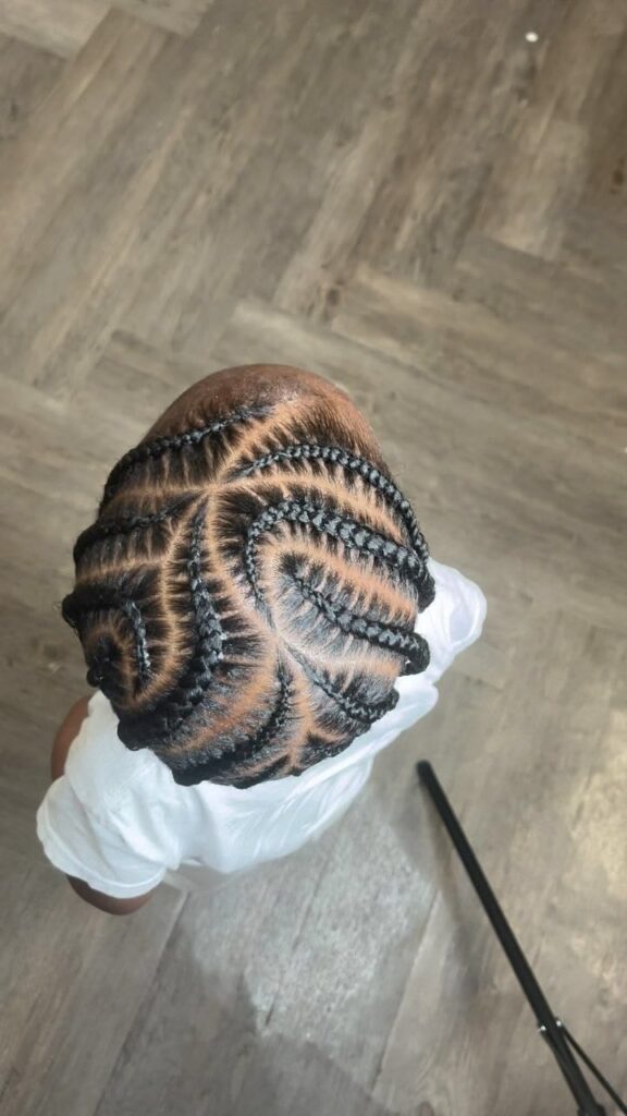 Boy with curved cornrows hairstyle