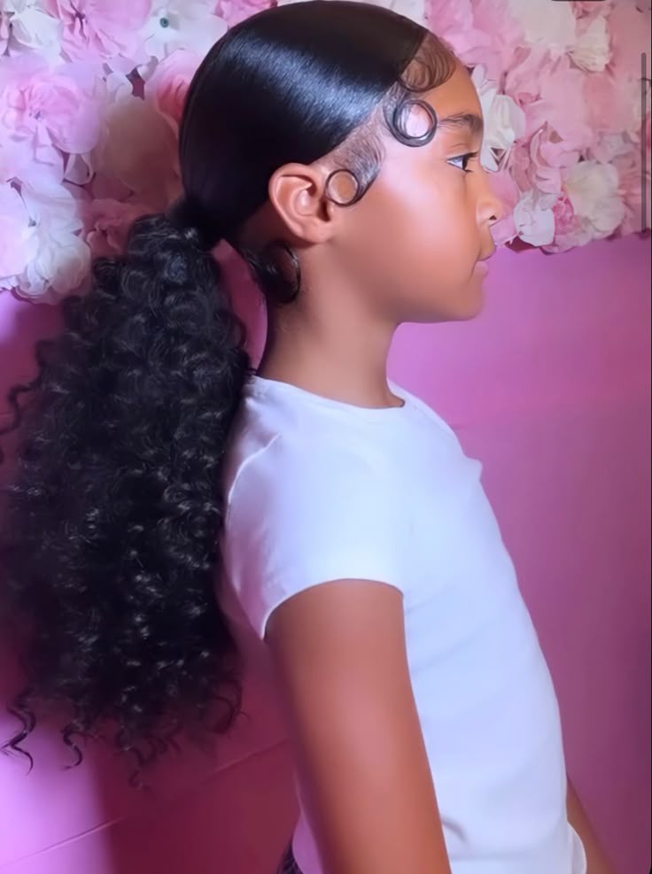 Girl with a low ponytail secured at the nape of the neck.