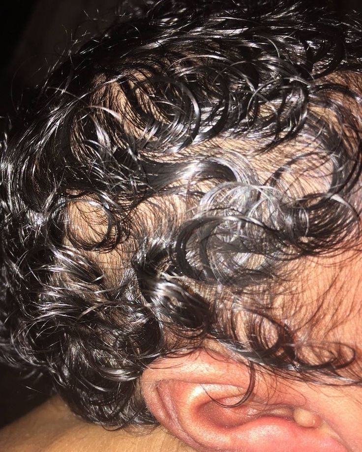 A healthy babys curly hair with clean scalp