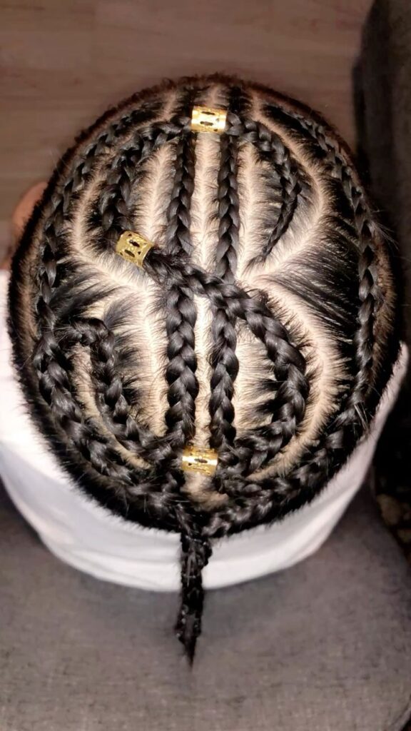 Dollar sign braids hairstyle with gold cuffs for boys
