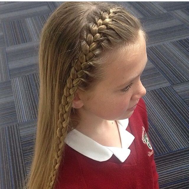  Child with a small braid across the top of the head like a headband, rest of hair left down